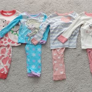 Seven sets of toddler girl pajamas